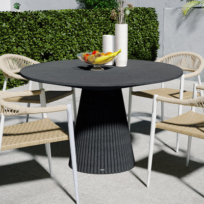 Xander 120cm Fluted Outdoor Concrete Dining Table Grey Marble, shown on a stone-tiled patio with four white-framed chairs