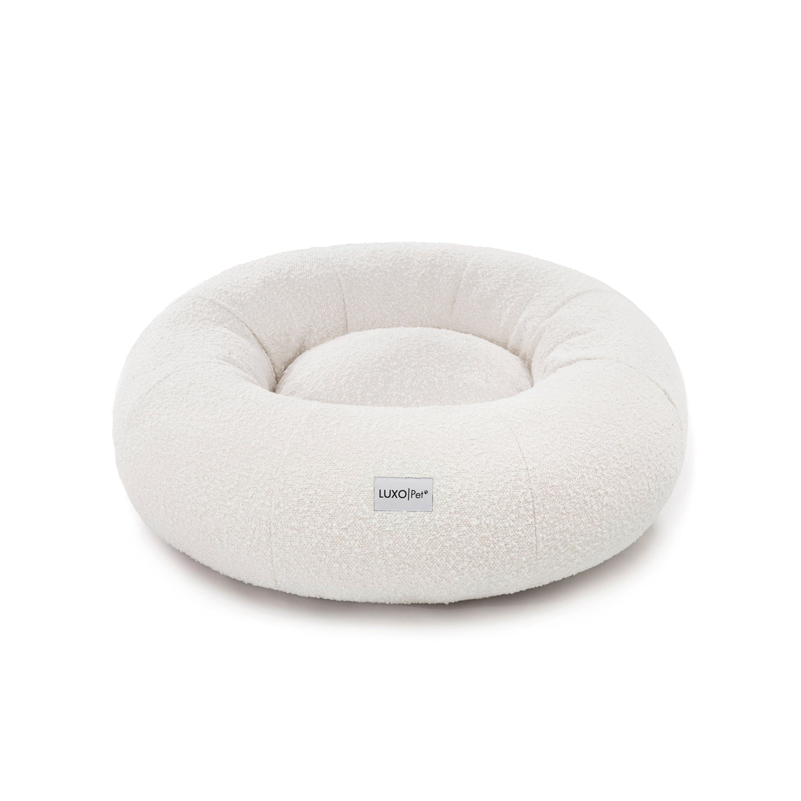 Kyra Medium Boucle Pet Bed – Light Beige Comfort, features soft, raised bolsters and plush boucle fabric, designed for ergonomic pet support and modern style, with a smooth, non-slip base.
