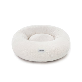 Kyra Medium Boucle Pet Bed – Light Beige Comfort, features soft, raised bolsters and plush boucle fabric, designed for ergonomic pet support and modern style, with a smooth, non-slip base.