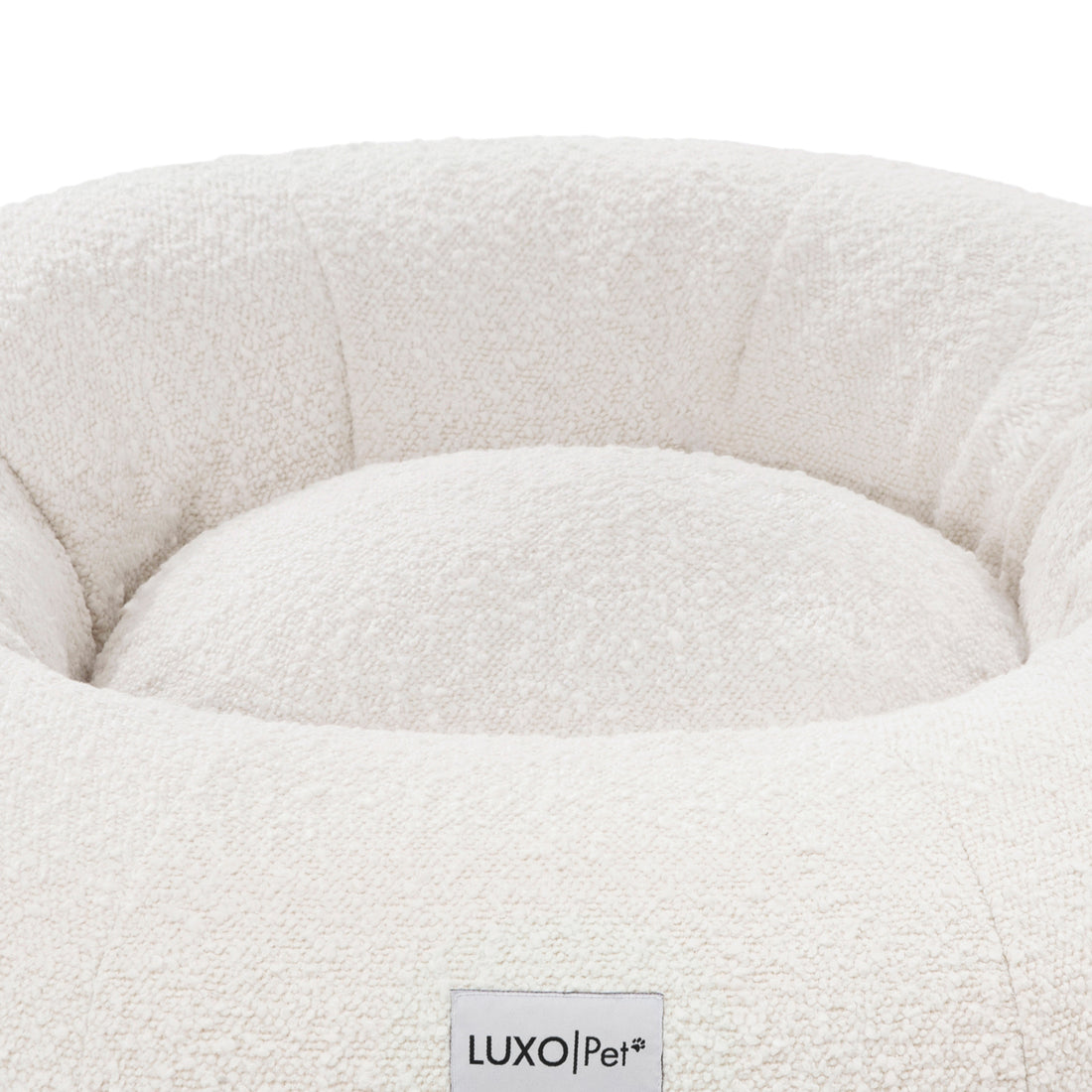 Kyra Medium Boucle Pet Bed – Light Beige Comfort: Close-up of plush, raised bolsters showcasing supportive, sculpted shape for ergonomic pet rest, emphasizing designer style with a non-slip base for modern interiors.