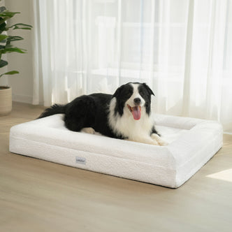 Tyro Luxe Large Orthopedic Pet Bed – Light Beige with a dog comfortably lying on it, showcasing the bed's soft boucle fabric and supportive dual-layer memory foam design for large pets.