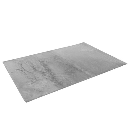 Azaliya 200x300cm Faux Rabbit Fur Floor Rug in Silver, featuring a plush, light-grey pile. The rectangular rug offers a luxurious, cosy texture, perfect for modern or contemporary indoor spaces.