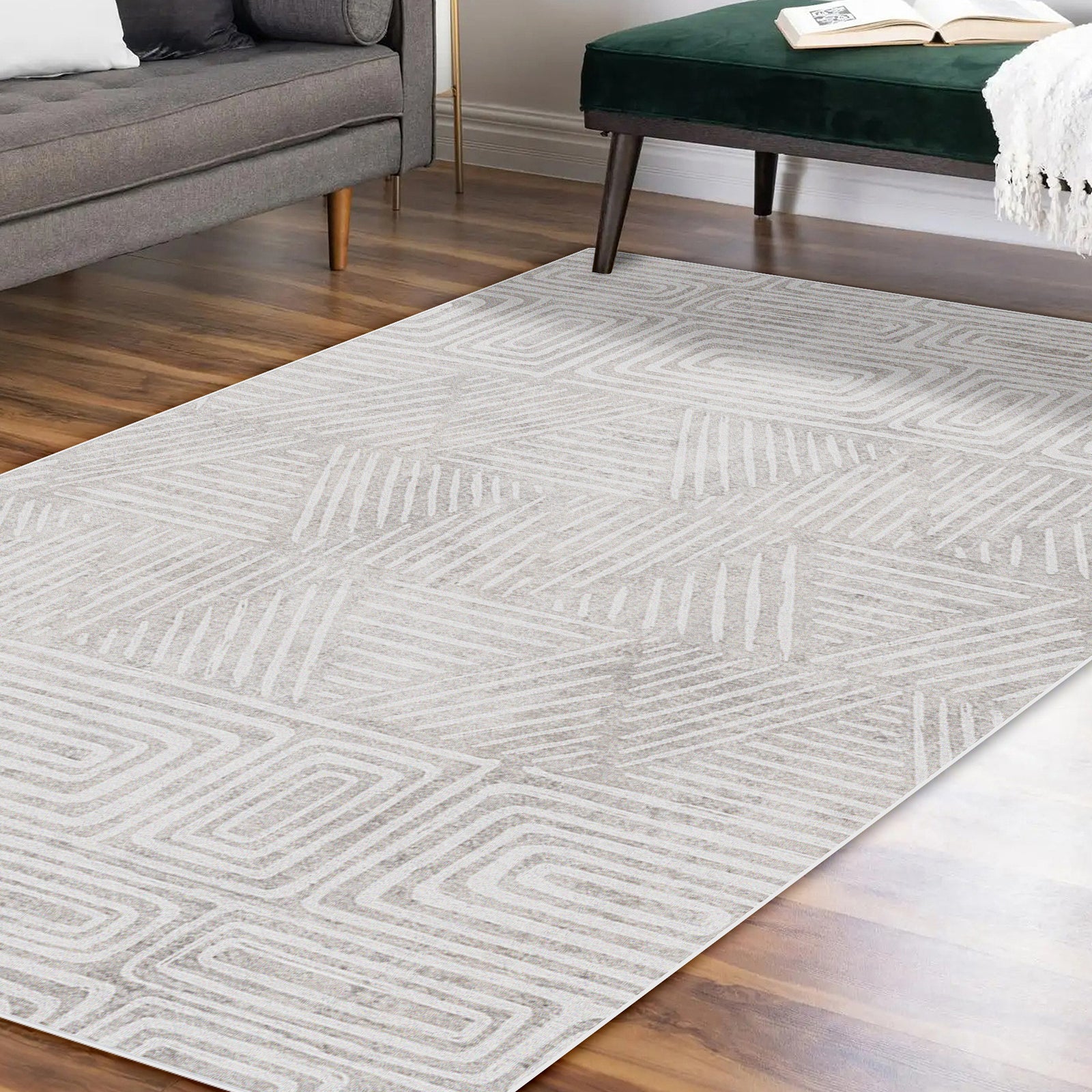 Duved contemporary indoor floor rug 160 x 230cm in grey with geometric pattern, shown on timber flooring beside a grey sofa