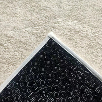 Close-up of Huken 200x300cm Large Modern Indoor Floor Rug, highlighting white fabric binding, black anti-slip dot underside on beige carpet, emphasizing its modern texture for contemporary homes.