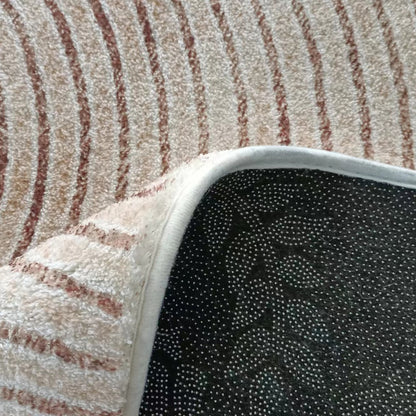 The Lunder 200x300cm Modern Abstract Floor Rug features a beige pile with rust-colored stripes and a non-slip black backing, ideal for enhancing décor and protecting floors.