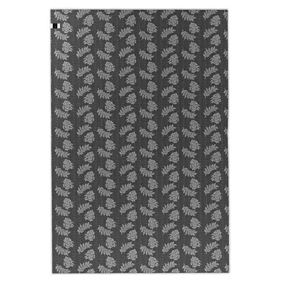 Melody Black & White Modern Rug 120x170cm showcases a Scandinavian-inspired design with black abstract lines on an ivory backdrop, ideal for complementing vibrant furniture in living or dining areas.