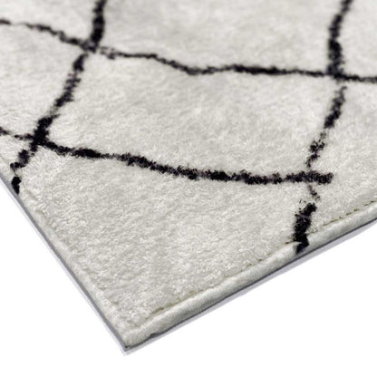 Close-up of the Melody Black & White Modern Rug 160x230cm, displaying black abstract lines on ivory, showcasing its Scandinavian-inspired design and soft texture, ideal for high-traffic areas.