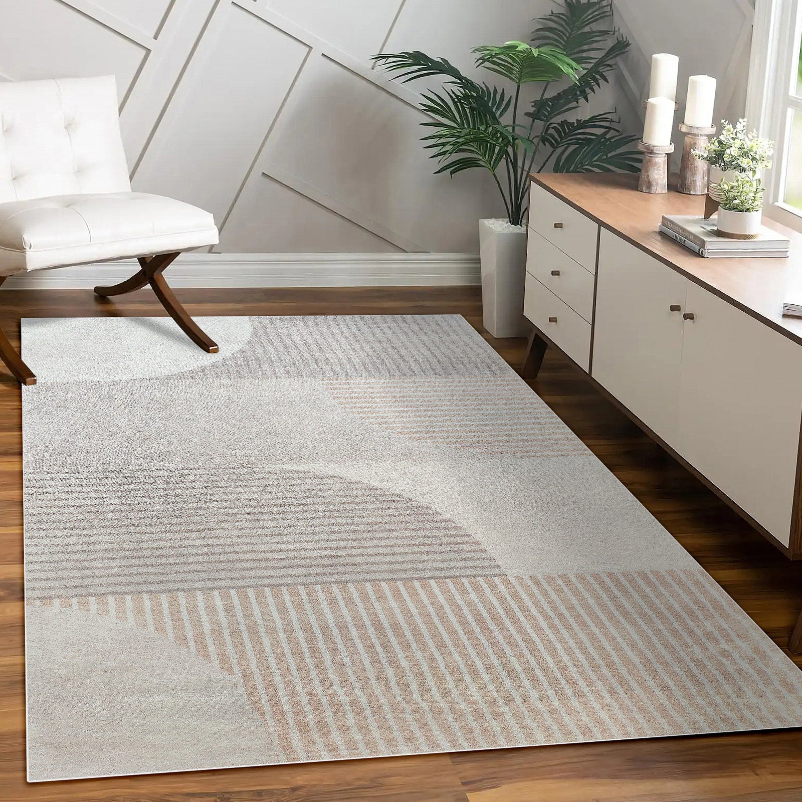 Olivia 160x230cm Polyester Tufted Modern Abstract Indoor Rug with geometric patterns, lying on hardwood floor in a minimal living space with a lounge chair, sideboard, and tropical plant.