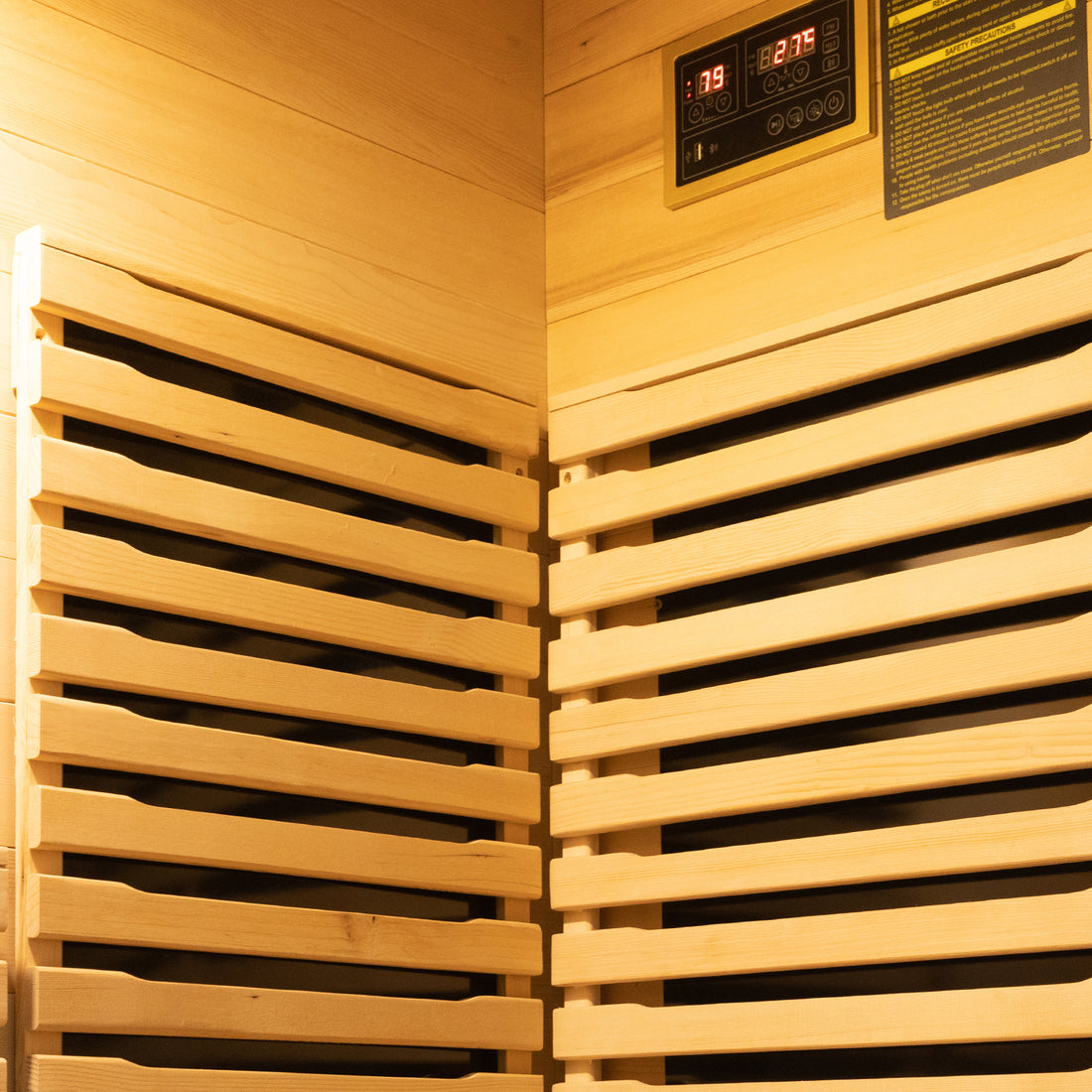 Harlow 1 Person Canadian Hemlock Infrared Home Sauna featuring light wooden slats, digital control panel with safety label, showcasing compact design and infrared heating elements.
