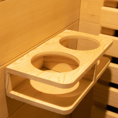 Harlow 1 Person Canadian Hemlock Infrared Home Sauna accessory showing a wall-mounted wooden shelf with two circular cutouts for holding cups or bottles, designed to attach to sauna walls.
