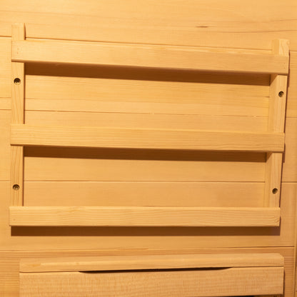 Harlow 1 Person Canadian Hemlock Infrared Home Sauna features a light-wood slatted frame mounted on a matching wood-paneled wall, showcasing its minimalist design for a serene indoor experience.