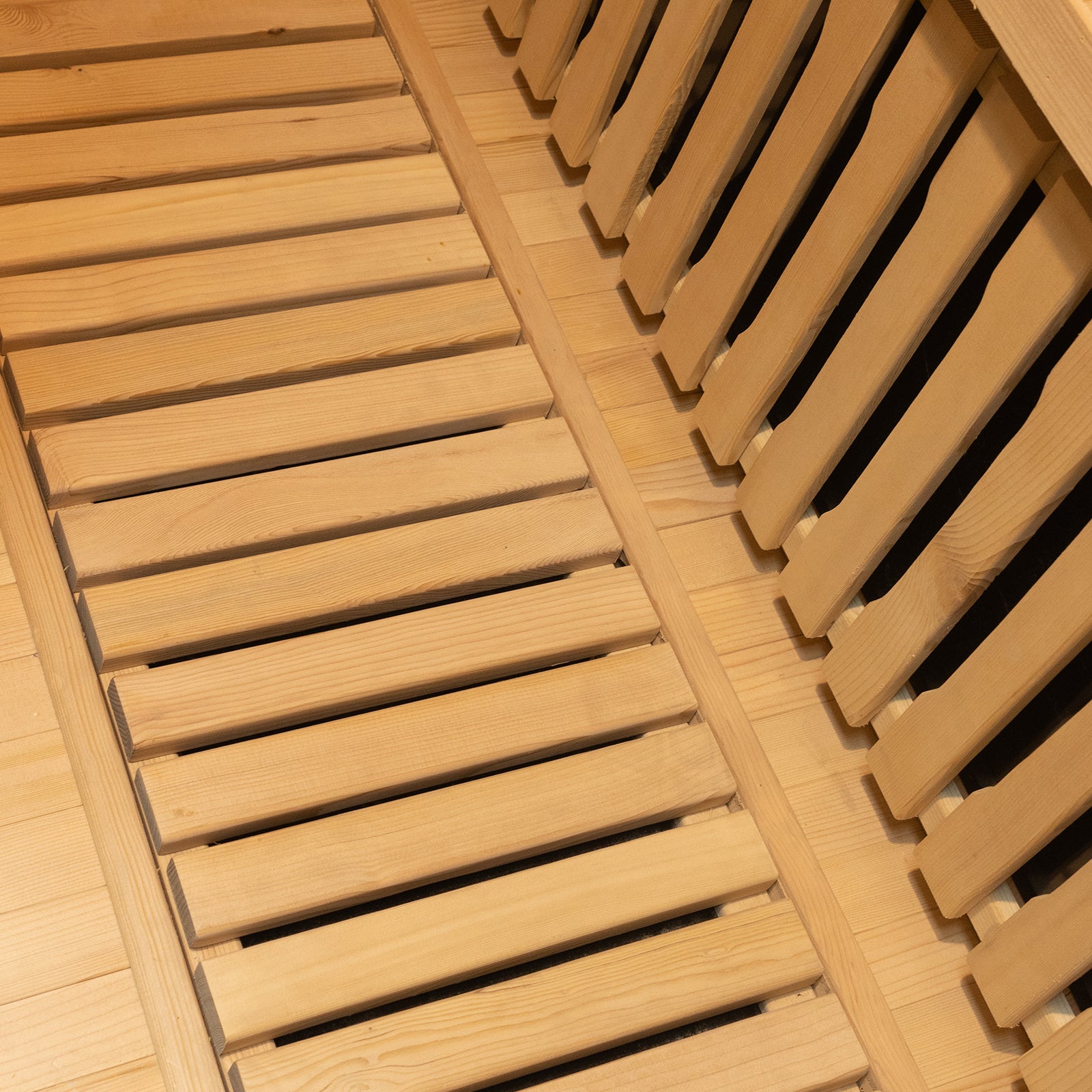 Harlow 2 Person Canadian Hemlock Infrared Home Sauna showcasing smooth light-colored wooden slats, indicative of its sleek Canadian Hemlock construction, perfect for a serene indoor wellness experience.