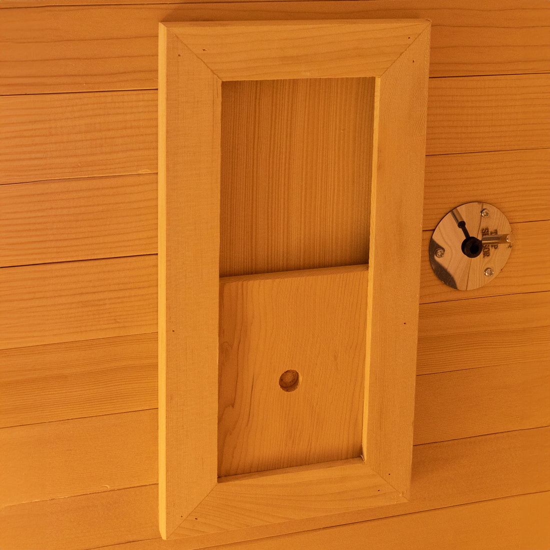 Harlow 2 Person Canadian Hemlock Infrared Home Sauna interior showing Canadian Hemlock wood paneling, recessed frame, and features for in-wall or in-ceiling installations, indicating advanced design for indoor wellness.