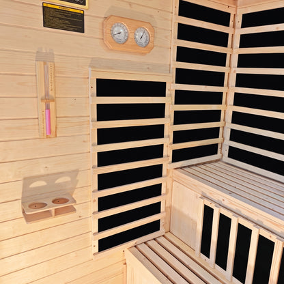 Interior of Kiima hybrid sauna showing natural fir wood walls, infrared heating panels, wooden benches, wall-mounted