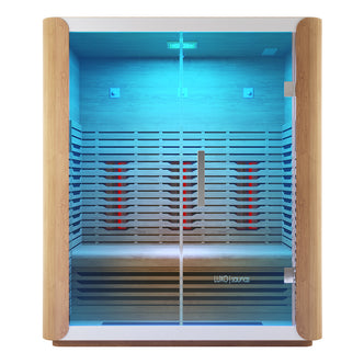 Lue 3 Person Full Spectrum Curved Infrared Indoor Home Sauna with light-wood framing, glass front, glowing infrared panels, blue accent lighting, and comfortable bench. Features stainless steel handle and Luxo Saunas logo.