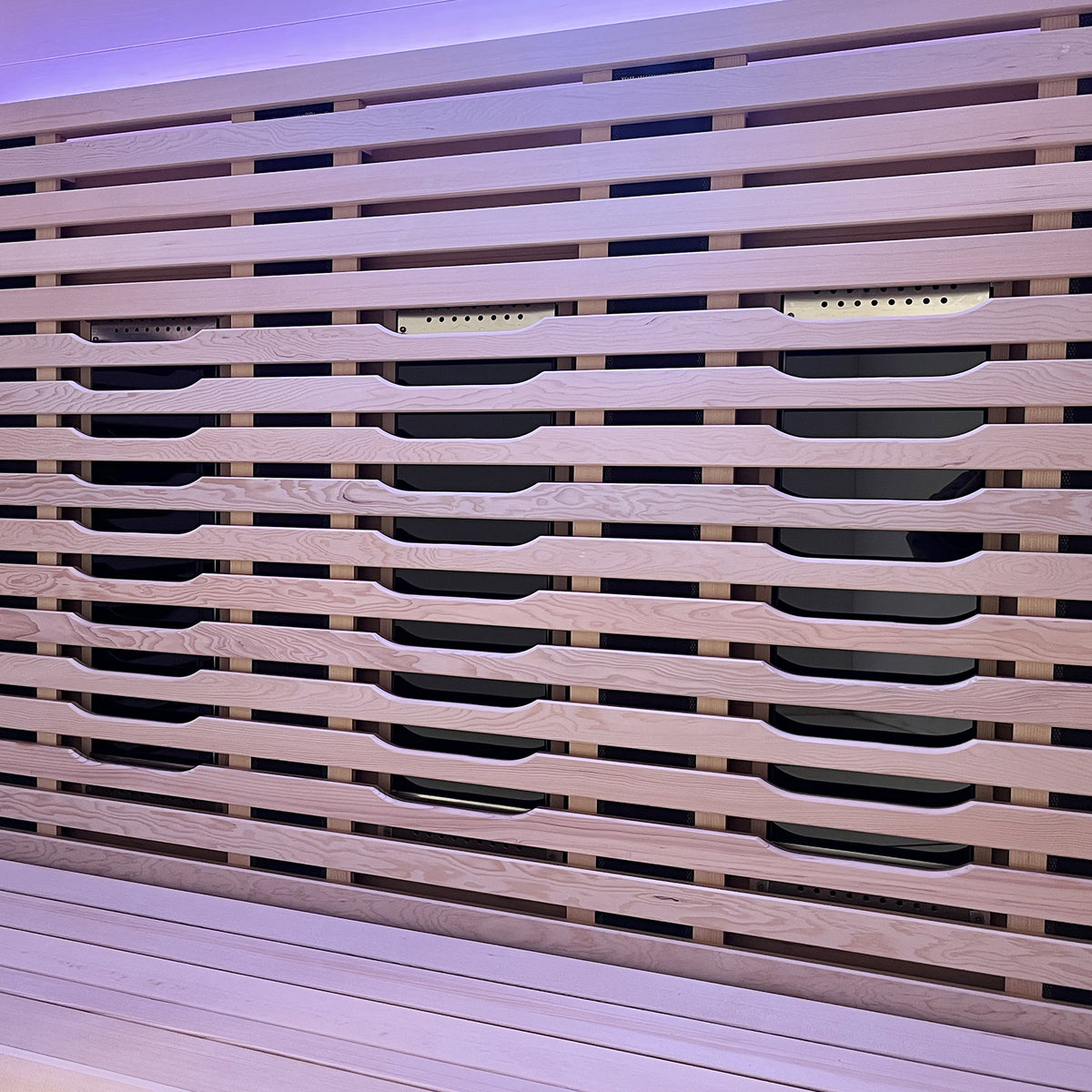 Lue 3 Person Full Spectrum Curved Infrared Indoor Home Sauna showcasing a close-up of sleek horizontal wooden slats with recessed handles, highlighting modern design and craftsmanship in Canadian Hemlock wood.