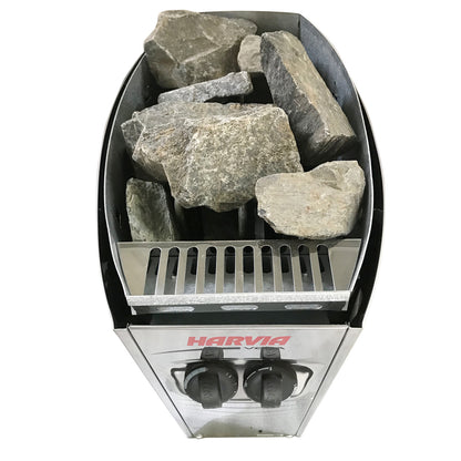 Luola 2 Person Pine Outdoor Barrel Sauna & Harvia Stove features a stainless-steel Harvia electric heater with top sauna stones and front control knobs, perfect for backyard relaxation.