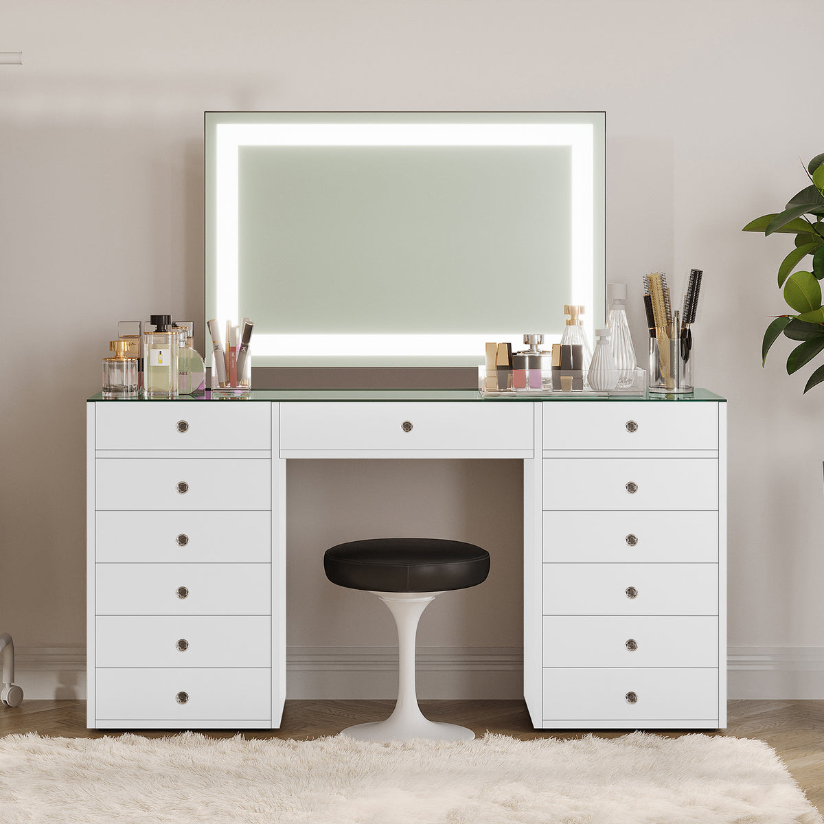 Adeline Makeup Vanity Table with LED Mirror in White features a sleek desk with a glass top, LED-lit mirror, and organized beauty essentials, complemented by a tulip-style stool for a modern aesthetic.