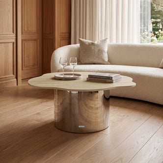 Asymmetric coffee table in a stylish living room with sofa and decor