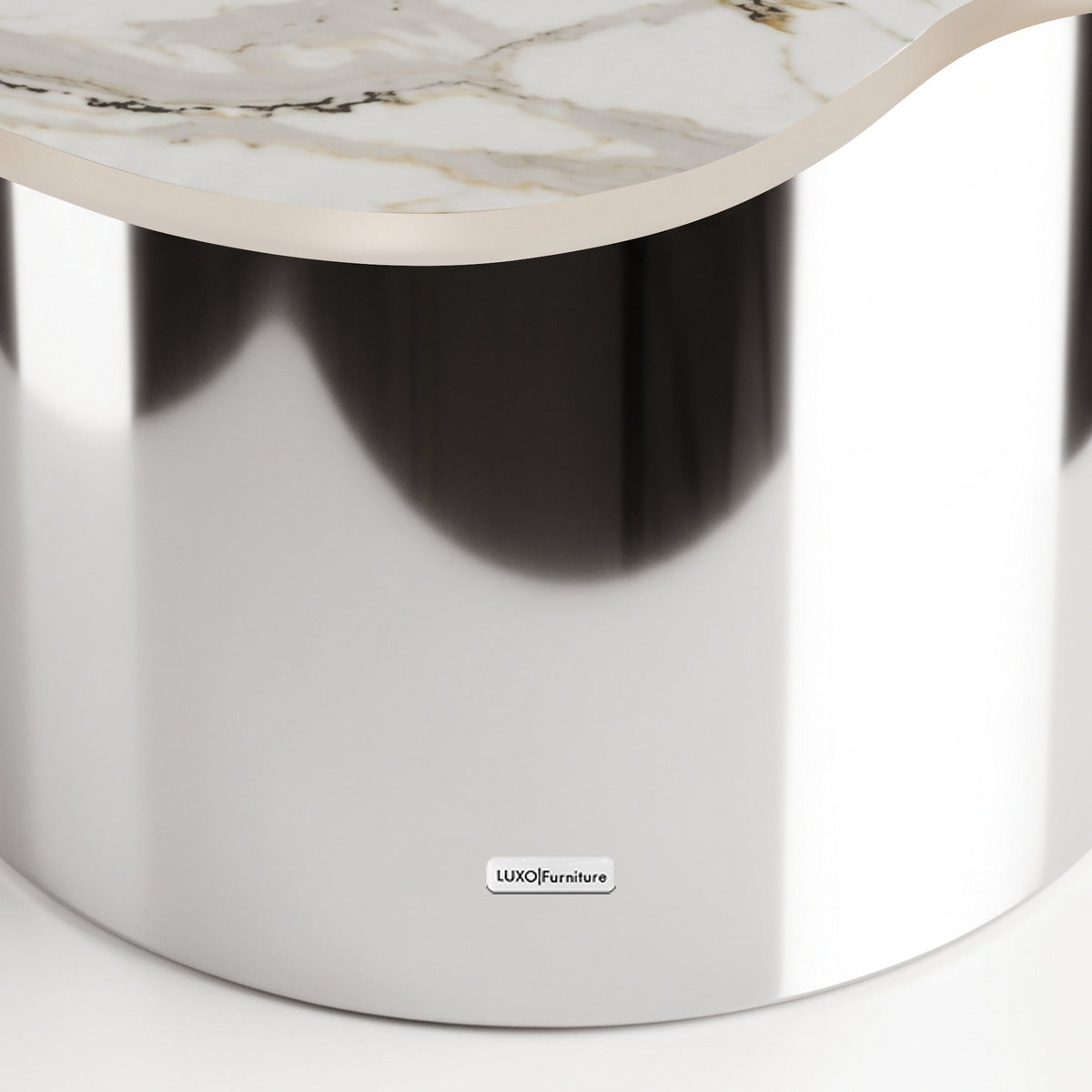 Close-up of a luxury table with a reflective metallic base and marble-like top on a white background