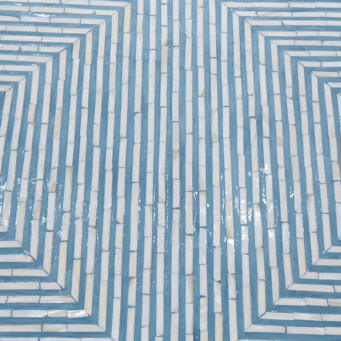 Close-up of blue and ivory mother-of-pearl inlay geometric pattern