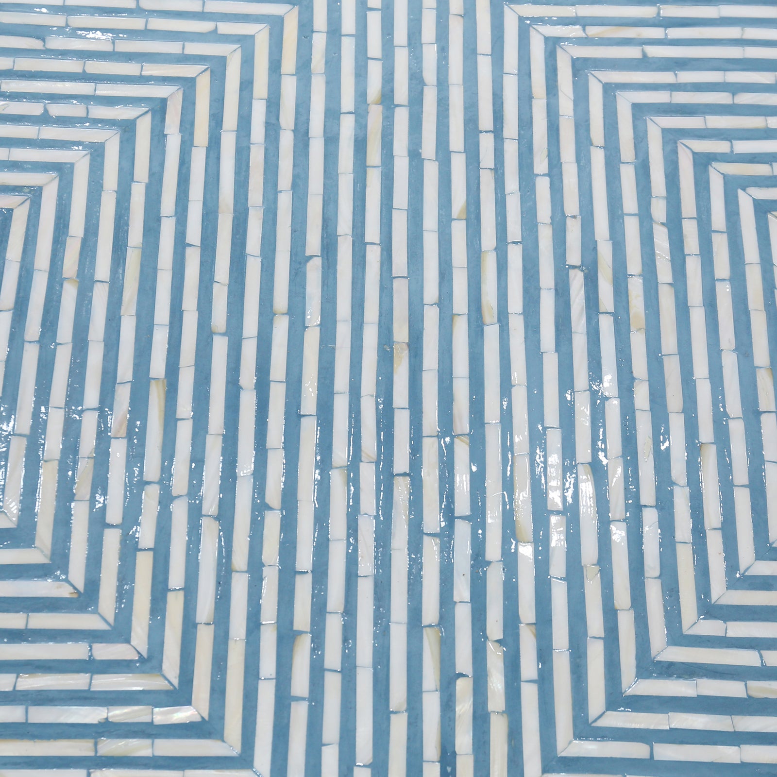 Close-up of blue and ivory mother-of-pearl inlay geometric pattern