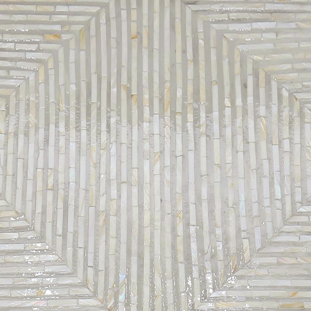 Audino Mother of Pearl Inlay Coffee Table in Ivory & Grey, showcasing a geometric mosaic pattern of glossy, narrow tiles with a pearly sheen, forming concentric hexagons, ideal for elegant interior décor.