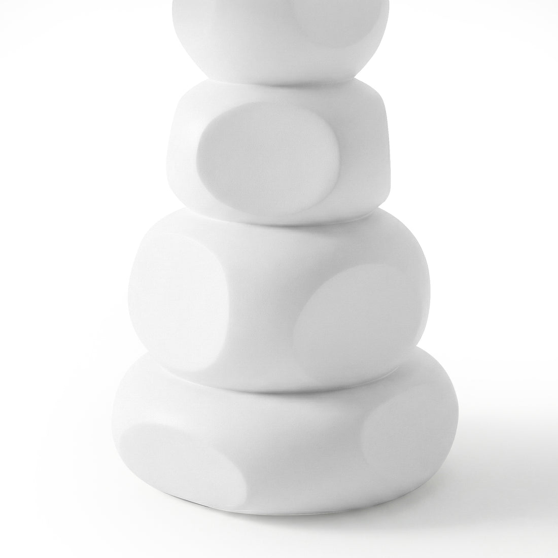 Close-up of stacked rounded white concrete base of outdoor dining table