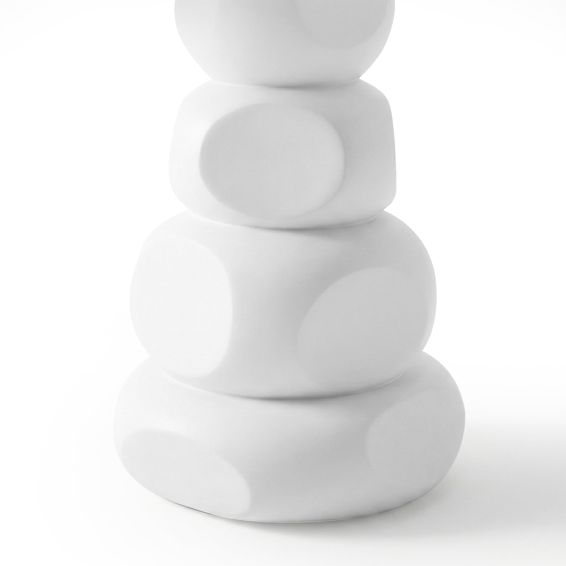 Close-up of stacked rounded white concrete base of outdoor dining table