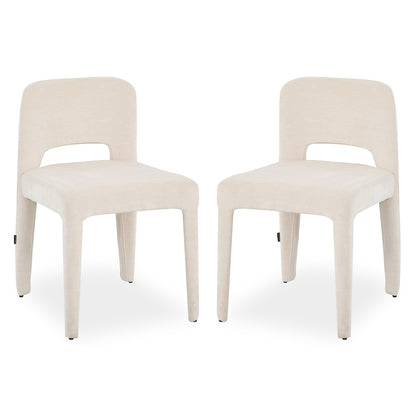 Two Edris upholstered dining chairs in oat fabric with curved backrest cutout and tapered legs