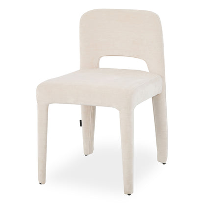 Edris upholstered dining chair in oat with curved backrest, cut-out detail and tapered fabric-covered legs