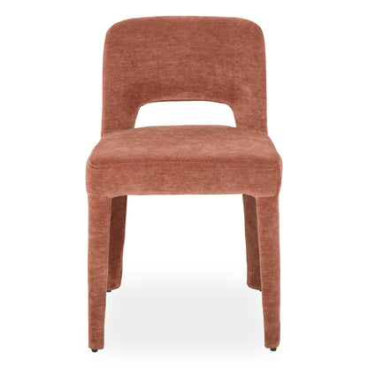 Edris upholstered dining chair in terracotta with curved backrest, cut-out detail and fabric-covered legs