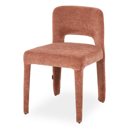 Edris upholstered dining chair in terracotta with curved backrest, cut-out detail and tapered legs