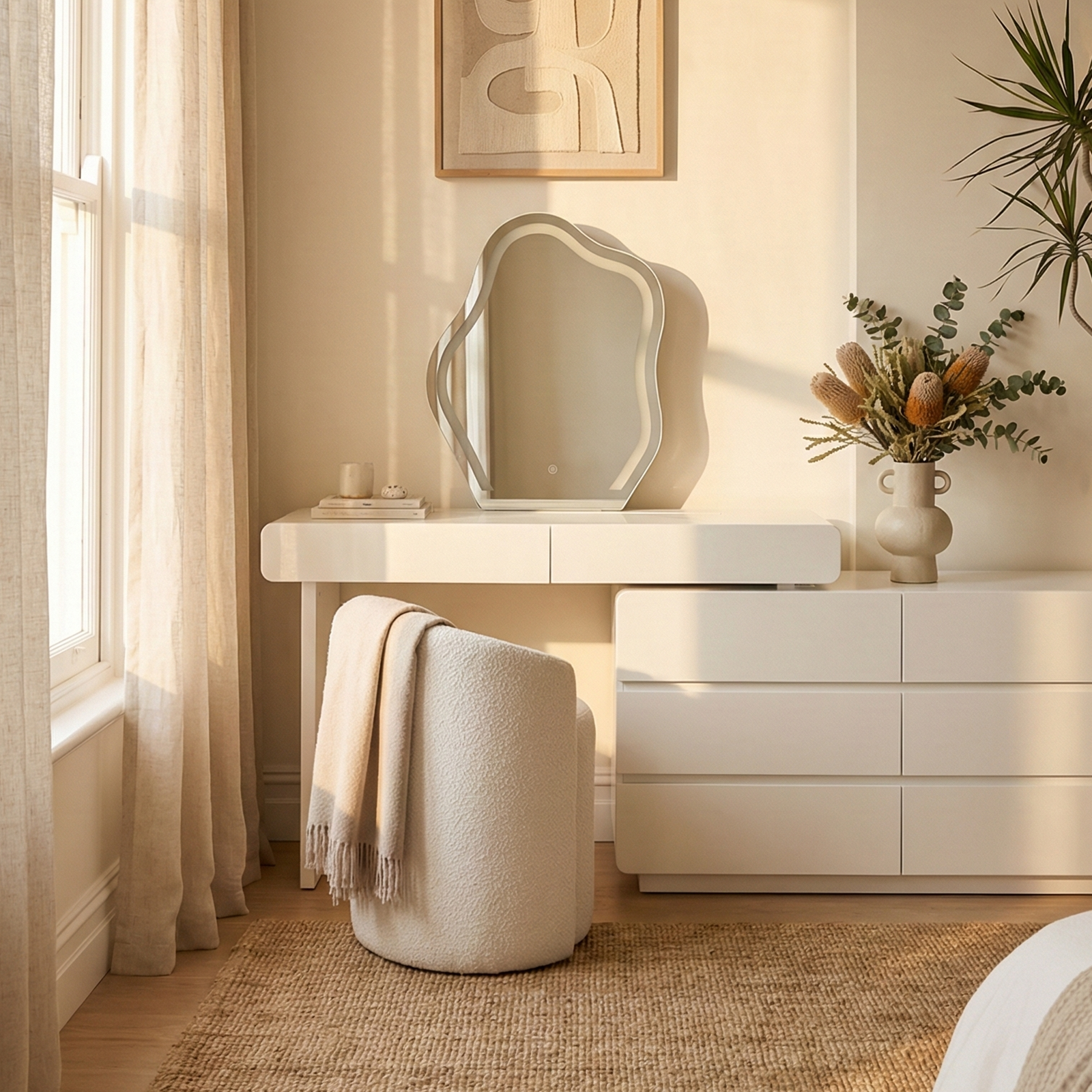 Eloura Extendable Vanity Storage Table in White with LED cloud mirror, paired with a boucle stool and cream throw, beside a