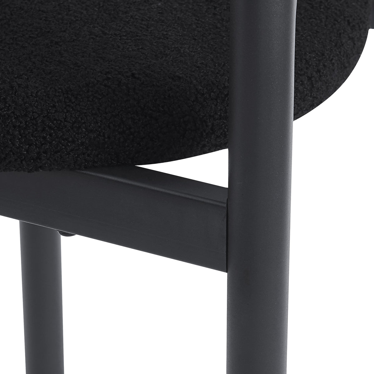 Gilles Boucle Arched Dining Chair Black Set of 2, featuring a sleek double-arched backrest and upholstered seats in luxurious boucle fabric, supported by a sturdy powder-coated metal frame.