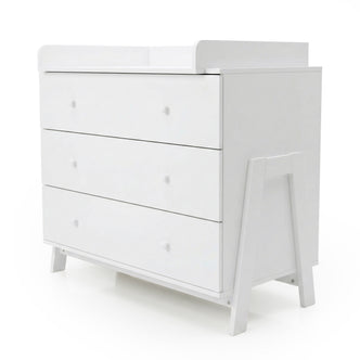 White three-drawer dresser with changing table on white background