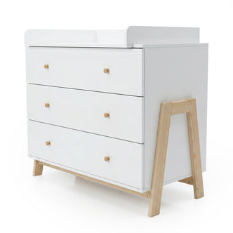 Modern white three-drawer dresser with natural wood accents on a white background