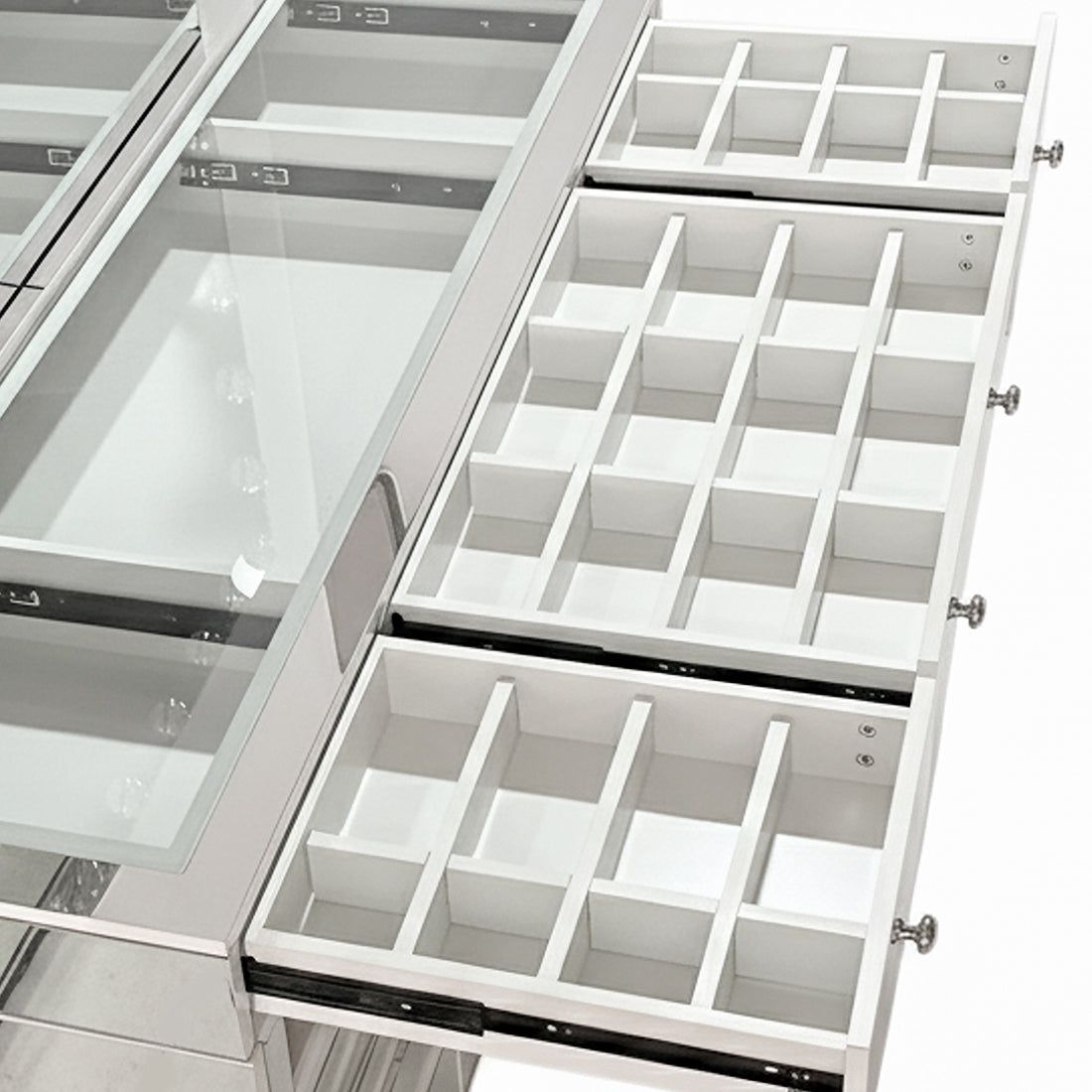 Ivy Diamond Crystal Mirror Finish Hollywood LED Vanity Table features a glass-topped compartment and three multi-drawer organizers, perfect for displaying and organizing jewelry or small parts.