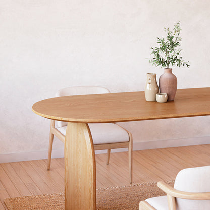 Close-up of the Jillian 180cm Solid Oak Oval Dining Table featuring elegant arched legs and a smooth oval top, highlighting its sturdy craftsmanship and modern design.