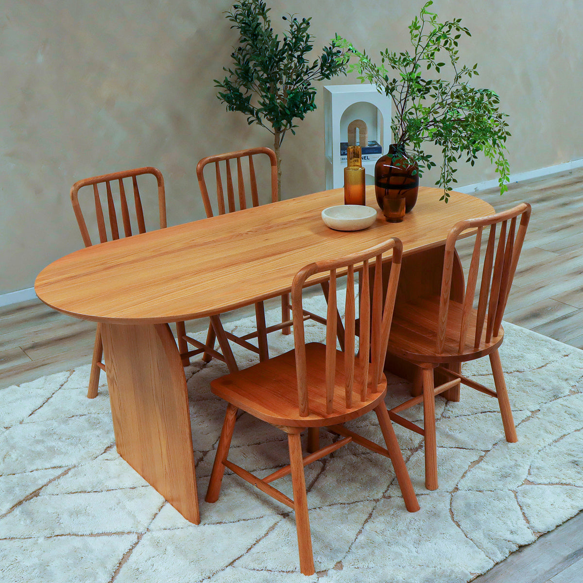 Jillian 180cm Solid Oak Oval Dining Table features a natural wood finish, arched legs, and a spacious, elegant design, ideal for dining rooms, comfortably seating up to four people.