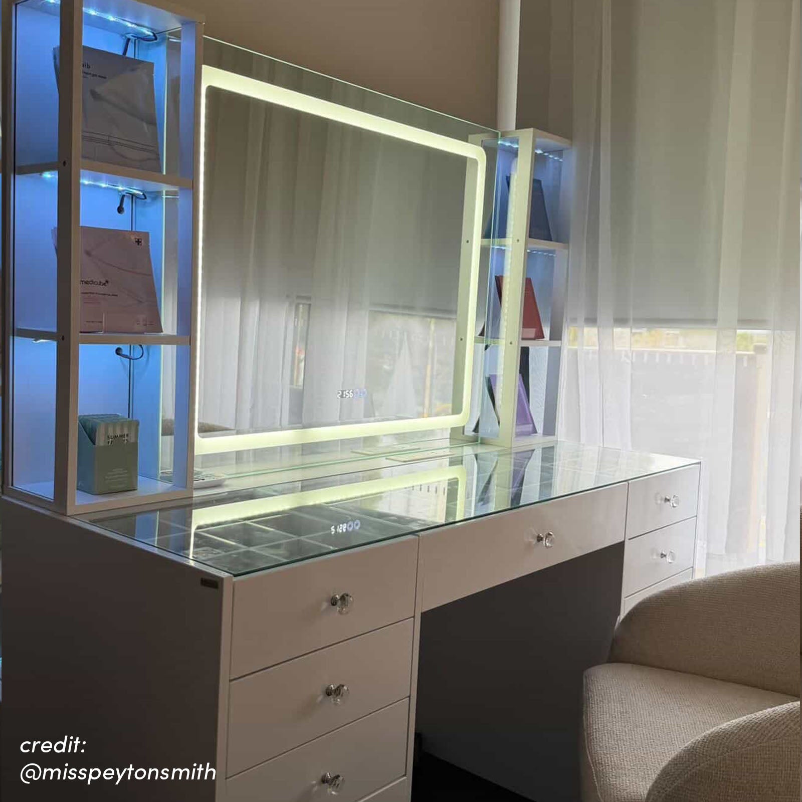 White LED vanity table with illuminated mirror, glass top, storage drawers and side shelving with blue lighting