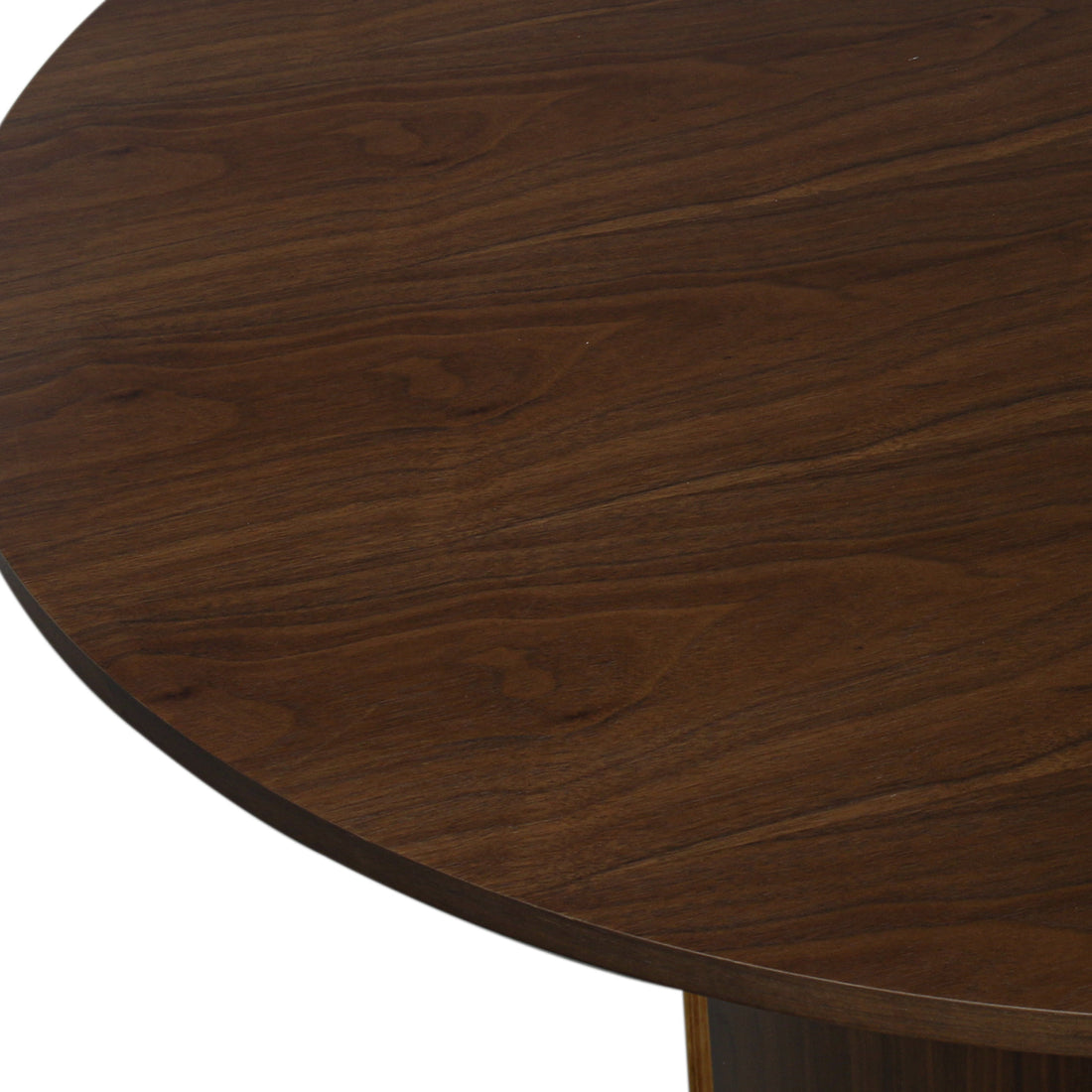 Close-up of the Kaylani & Winfield 5-Piece Wooden Dining Set, showcasing the round veneer table's smooth walnut finish and the sleek design of the black velvet upholstered chairs.