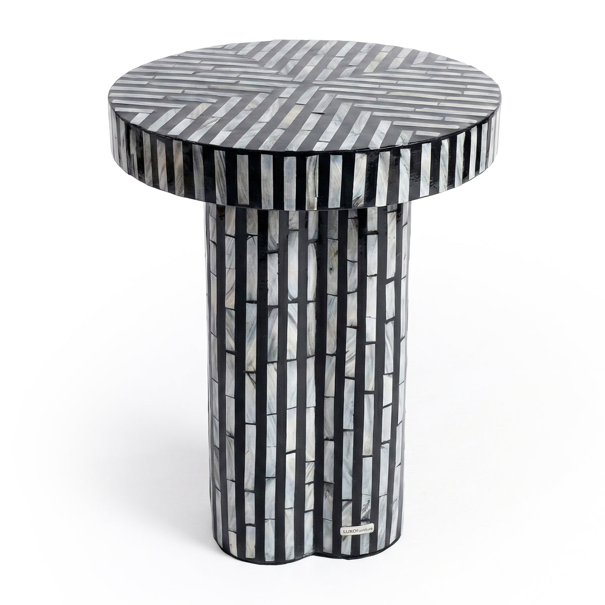 Round side table with black and gray geometric pattern on white background
