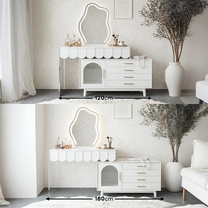 White extendable dressing table with scalloped edge, LED-lit wavy mirror, and side cabinet with gold handles, shown in 120cm