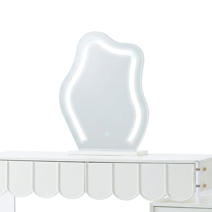 Wavy LED vanity mirror sitting on a white dressing table with a scalloped apron.