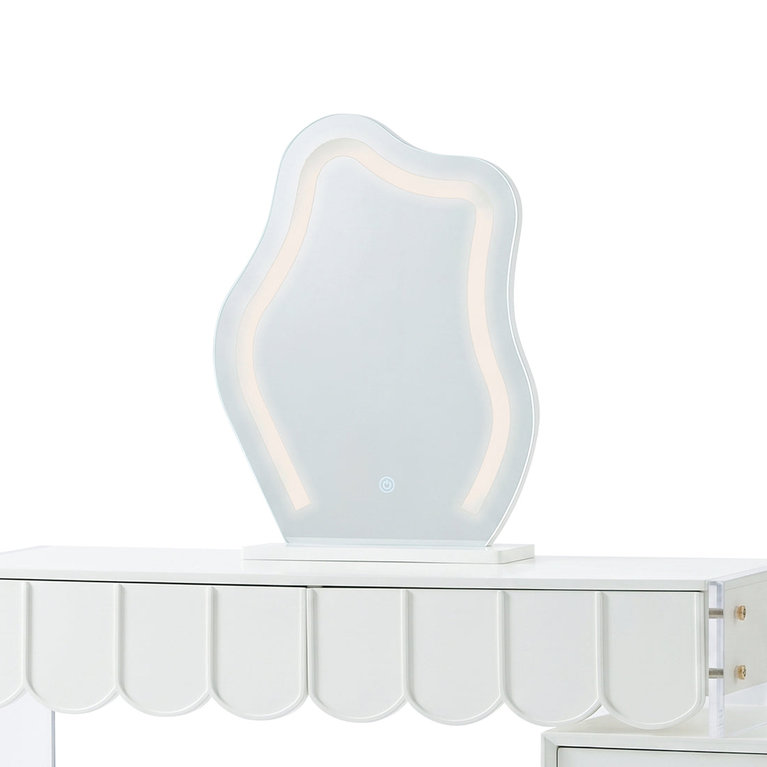 Wavy LED vanity mirror sitting on a white dressing table with a scalloped apron.