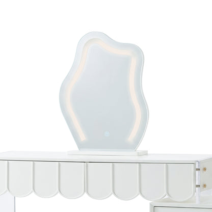 Wavy LED vanity mirror sitting on a white dressing table with a scalloped apron.