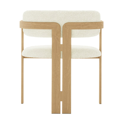 Close-up of the Maddi Boucle Hardwood Dining Chair showcasing its curved backrest, soft boucle upholstery, and sturdy American wood frame, highlighting its stylish and ergonomic design.