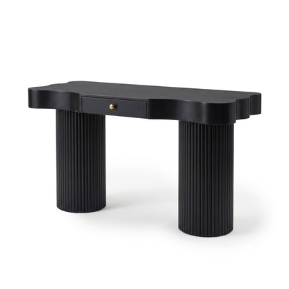 Black console table with scalloped top and cylindrical fluted legs on a white background