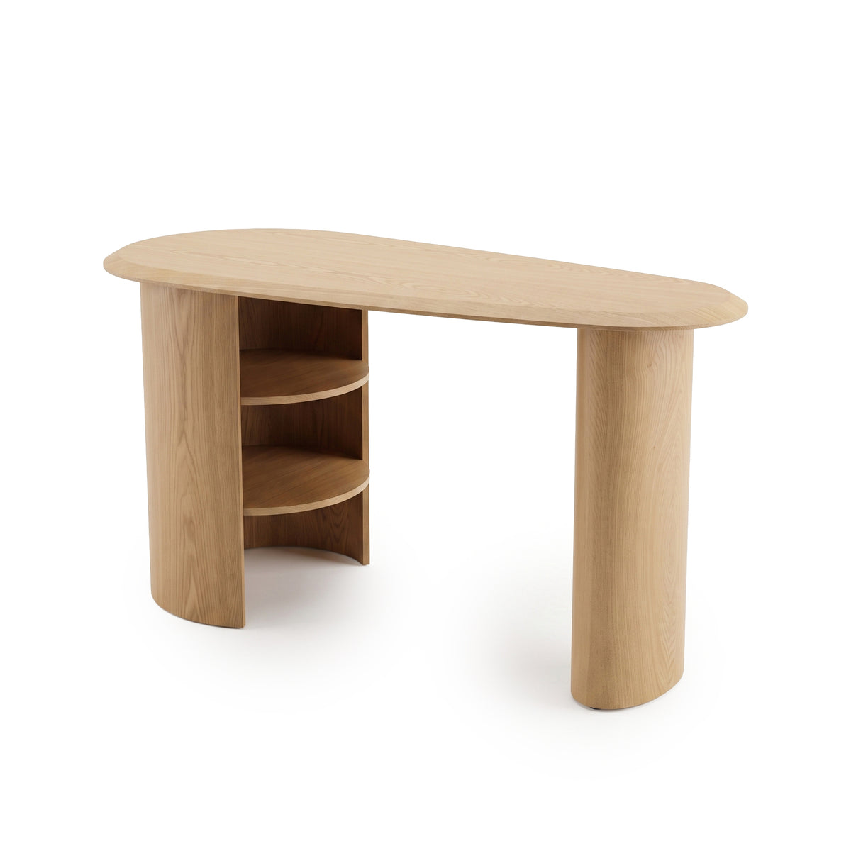 Asymmetrical light wood desk with rounded edges and built-in shelves on a white background.
